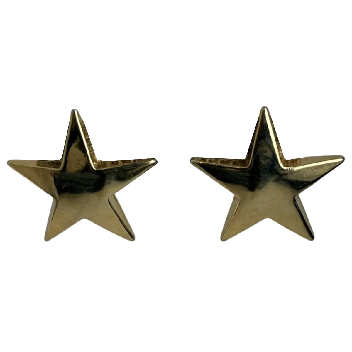 A pair of gold star-shaped stud earrings on a plain white background.