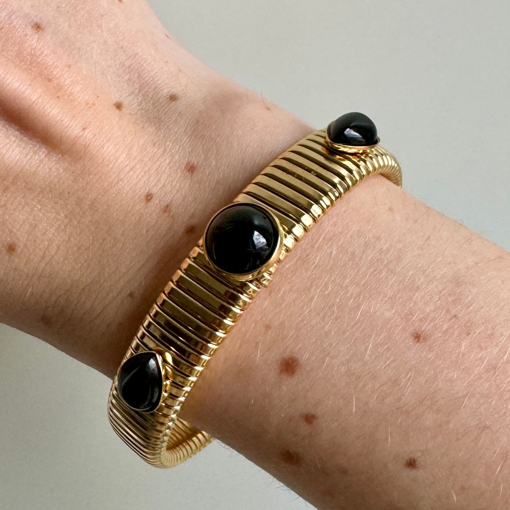 Gold Cobra Bracelet with Black Stones